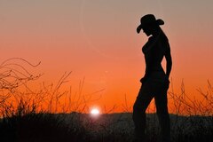 Cowgirl Silhouette in the Sunset